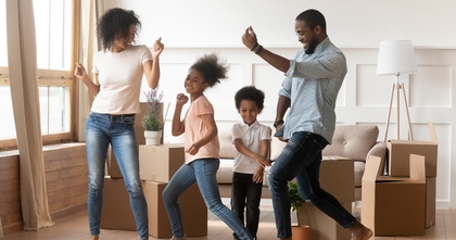 Happy African American family dancing