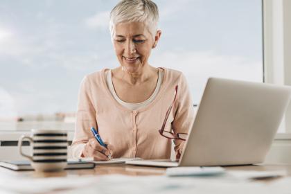 Woman creating moving checklist