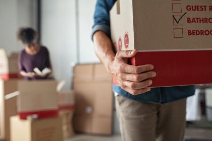 Couple packing boxes on Moving Day