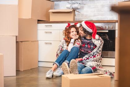 Happy Couple Moving During Holidays