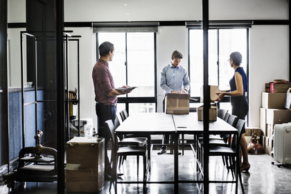 Business People Packing Boxes